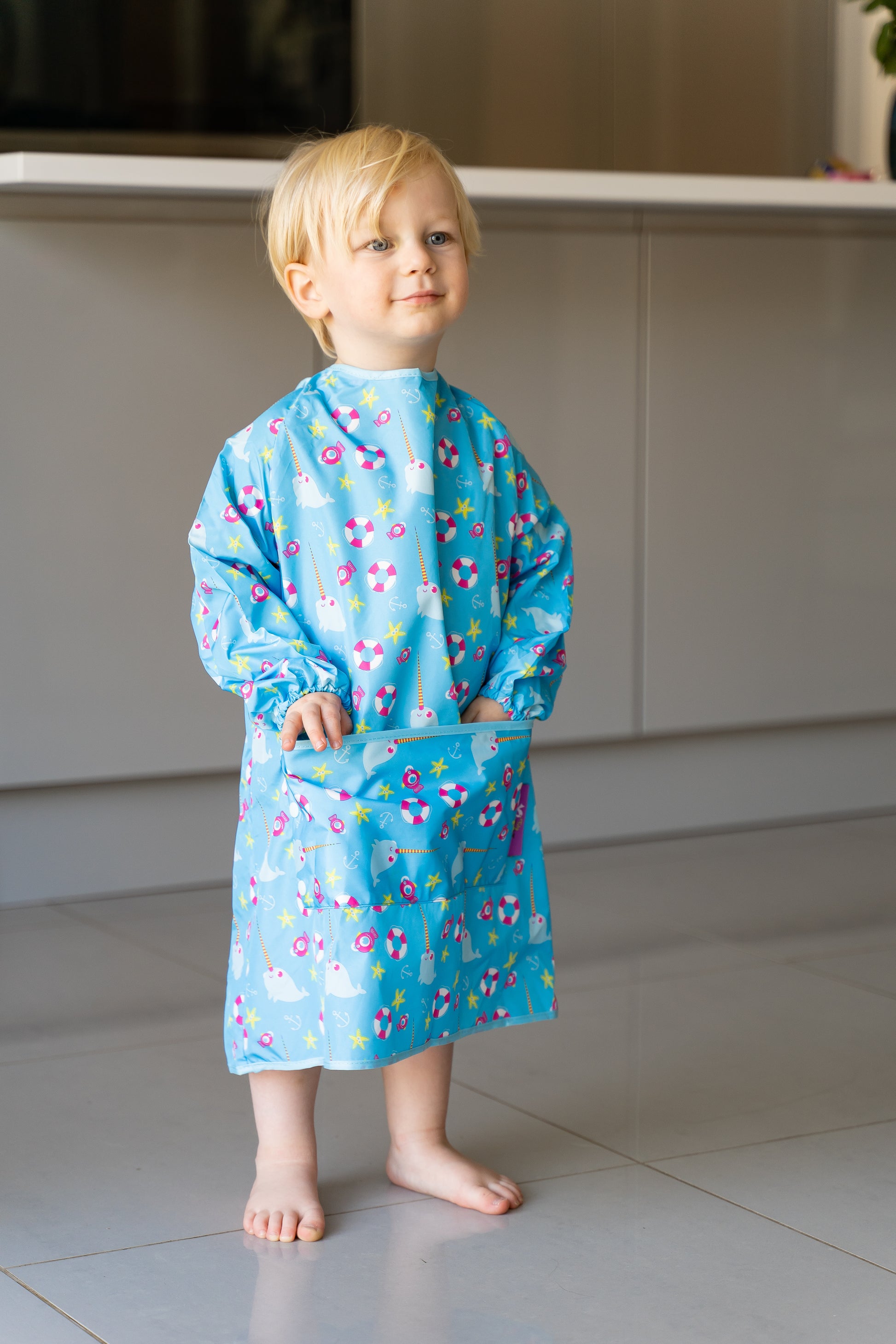 Toddler in the Tidy Tot Long Length Coverall Bib at mealtime