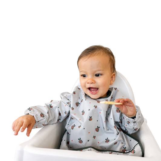 Baby wearing Simply Tidy Tot Bib in Bees